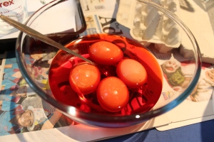 Pop your eggs gently into the dye in a single layer. Ideally the dye should cover the eggs.
