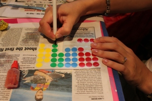 To occupy the drying time, use stickers to decorate the eggs. We drew on coloured dots and made spotty eggs!
